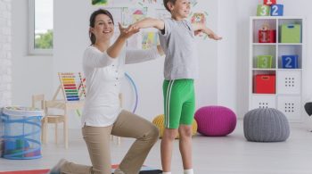 physiotherapist-exercising-with-a-school-boy-1536x1024